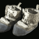 Illustration for article titled These Boots Took the Final Steps on the Moon